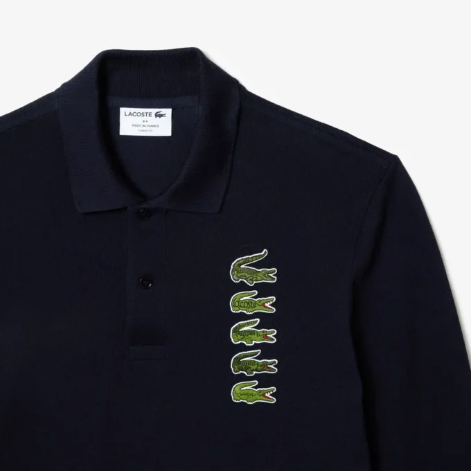 Ανδρική Polo Μπλούζα Original L.12.12 με μακριά μανίκια και πολλαπλά εμβλήματα Ανδρική Polo Μπλούζα Original L.12.12 με μακριά μανίκια και πολλαπλά εμβλήματα