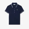 Γυναικείο Polo Μπλούζα L.12.12 με στενή γραμμή και λεπτομέρειες στο τελείωμα Γυναικείο Polo Μπλούζα L.12.12 με στενή γραμμή και λεπτομέρειες στο τελείωμα