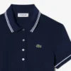 Γυναικείο Polo Μπλούζα L.12.12 με στενή γραμμή και λεπτομέρειες στο τελείωμα Γυναικείο Polo Μπλούζα L.12.12 με στενή γραμμή και λεπτομέρειες στο τελείωμα