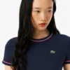 Γυναικείο T-shirt από jersey με διακοσμητικές λεπτομέρειες σε αντίθεση Γυναικείο T-shirt από jersey με διακοσμητικές λεπτομέρειες σε αντίθεση