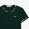 Γυναικείο T-shirt από jersey με διακοσμητικές λεπτομέρειες σε αντίθεση Γυναικείο T-shirt από jersey με διακοσμητικές λεπτομέρειες σε αντίθεση