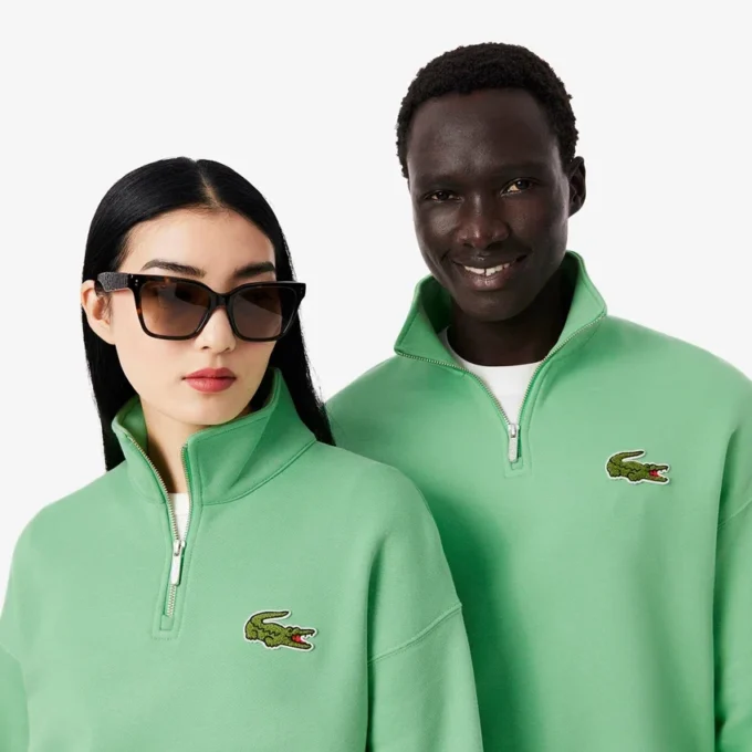 Unisex φαρδύ φούτερ με μισό φερμουάρ και διακοσμητικό έμβλημα