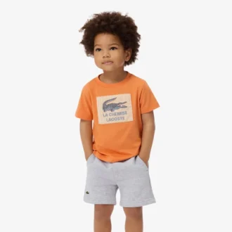 Βαμβακερό T-shirt με διακοσμητικό έμβλημα