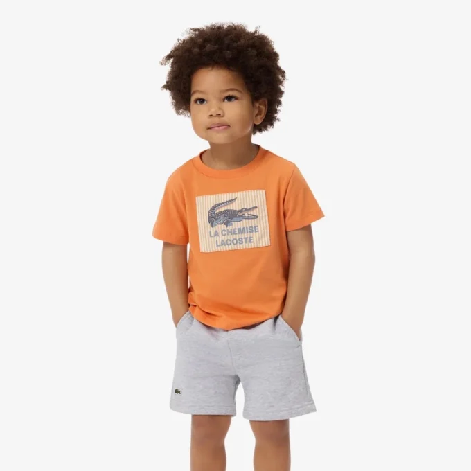 Βαμβακερό T-shirt με διακοσμητικό έμβλημα